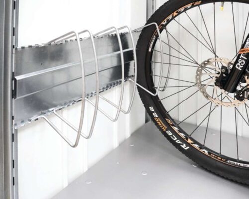 Bike holder with adjustable clamping brackets made of metal. One bicycle is clamped in between one of those racks.