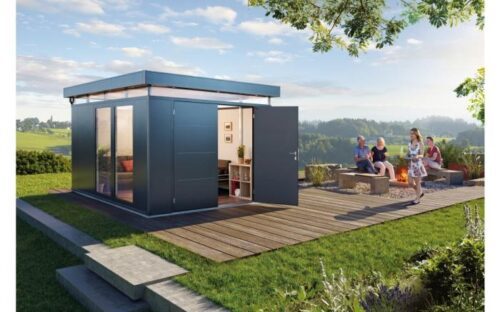 A dark grey, modern garden house with open standing doors and two glass elements on the left side. The garden house stands in a large, beautiful garden. Biohort glass element CasaNova Softub Switzerland