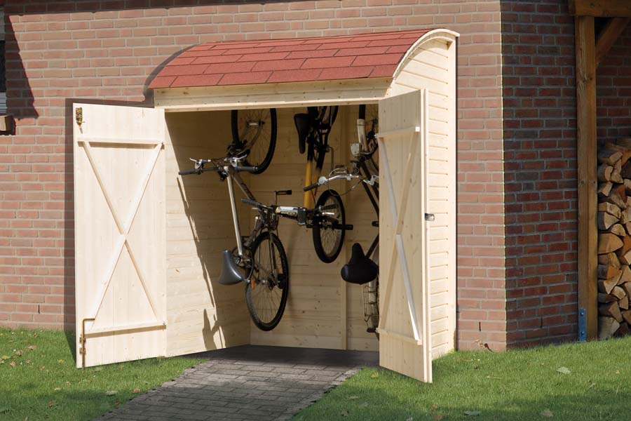 A box with an open standing double door and two hanging bicycles. The box has a red, rounded roof. 