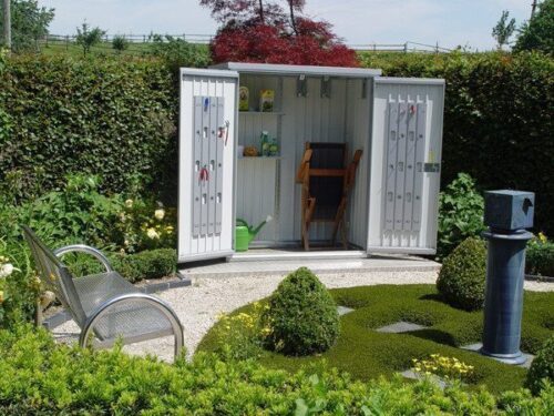 metallic equipment locker standing in a garden with open doors